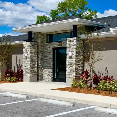 Modern building entrance with stone facade